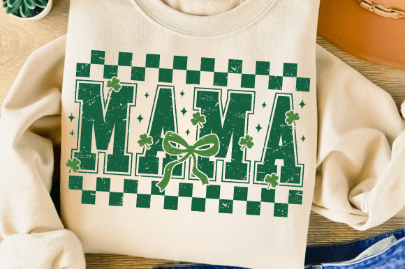 Close-up of "Mama" in large green font on a tan tee.