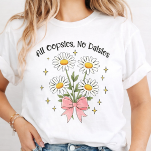 Woman wearing a white shirt with daisies and the phrase All Oopsies No Daisies