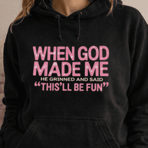 Black hoodie with the phrase When God Made Me He Grinned and Said Thisll Be Fun